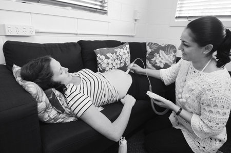 CABLE BAY  - APR 02 2014:Midwife checks baby heart beat and movement.Midwifery is a health care profession in which providers offer care to women during pregnancy,labor ,birth and postpartum.のeditorial素材
