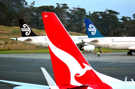 AUCKLAND - APR 10 2014:Air New Zealand and Qantas planes in Auckland International Airport.In 2006,...