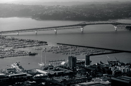 AUCKLAND, NZ - OCT 08:Aerial view of Auckland harbor bridge on Oct 08 2013.The daily average number of cars crossing the Auckland Harbour Bridge is presently around 165,000.(BW)のeditorial素材