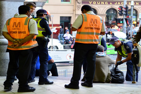 MELBOURNE,AUS - APR 14 2014:Victoria Policemen on duty.As of 2013, Victoria Police has over 12,539 members across 325 police stations.It has a running cost of aprox. 2.1b $AUD (A$372 per resident).のeditorial素材