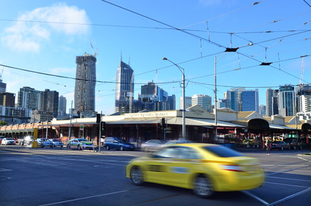 MELBOURNE, AUS - APR 12 2014: Taxicab pass by Queen Victoria Market. It is a major landmark and the largest open air market in the Southern Hemisphere.のeditorial素材