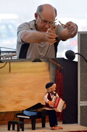 AUCKLAND,NZ - JUNE 01 2014:Puppeteer  manipulate puppets during puppetry show. It is very ancient  and is believed to have originated 3000 years BC.のeditorial素材