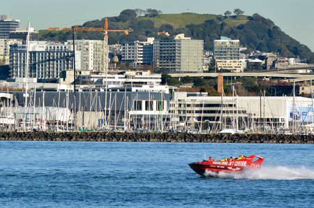 AUCKLAND - MAY 28 2014:Auckland Jet boat adventure tours in Waitemata Harbour.The speed boat, Ruby Red Lips, top Speed is 42 knots / 85 - 90 Kms with the capacity of 23 passengers.のeditorial素材