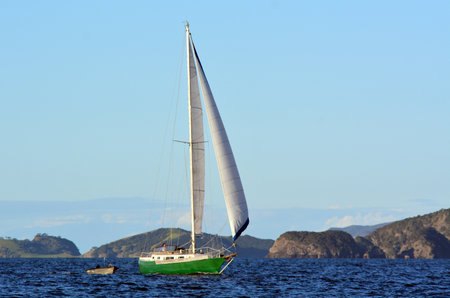PAIHIA,NZ - MAY 11 2014:Yacht sail in the Bay of Islands.It is one of the most popular fishing,...