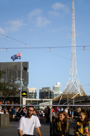 MELBOURNE - APR 13 2014:Visitors at the Federation Square.It located at the heart of Melbourneâs CBD with size of an entire city block.It's home to major cultural attractions and world-class events.のeditorial素材