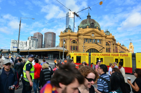 MELBOURNE, AUS - APR 13 2014:Pedestrians cross Flinders Street towards Flinders Street railway station.It's on of the most busiest pedestrian crossings in Australia and the busiest of Melbourne's.のeditorial素材