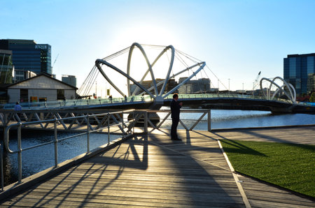 MELBOURNE,AUS - APR 14 2014:Visitors at Seafarers Bridge.It's a popular and famous footbridge over the Yarra River between Docklands and South Wharf in Melbourne, Victoria, Australia.のeditorial素材