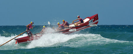 SURFERS PARADISE - NOV 08 2014:Surf rowers.More than 400 surf rowers and 55 surfboats hit the waves...