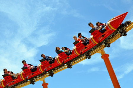 GOLD COAST, AUS -  NOV 06 2014:Visitors ride on Road Runner Roller Coaster in Movie World Gold Coast Australia.It's a 335-metre (1,099 ft) Junior Coaster reaches a top speed of 45.9 km/h (28.5 mph)のeditorial素材