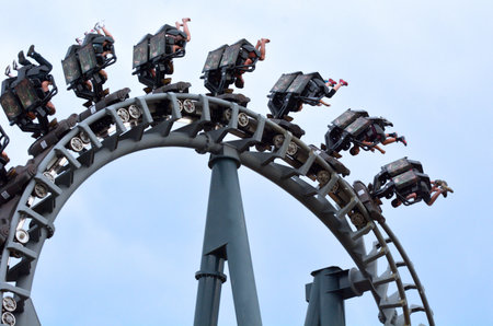 GOLD COAST, AUS -  NOV 06 2014:Visitors ride on Arkham Asylum â Shock Therapy in Movie World Gold Coast Queensland Australia.It was the first steel inverted roller coaster at an Australian theme park.のeditorial素材
