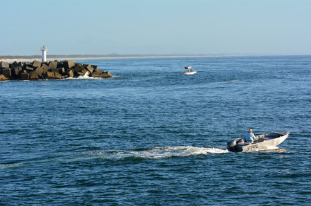 GOLD COAST - OCT 13 2014:Fisherman at Seaway.It's the main navigation entrance from the Pacific Ocean into Gold Coast Broadwater. It's one of Australiaâs most significant coastal engineering projects.のeditorial素材