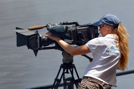 GOLD COAST, AUS - NOV 06 2014:Camerawoman filming. In 2006, there were approximately 27,000...