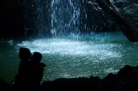 GOLD COAST - OCT 06 2014:Couple kiss in Natural Bridge at Springbrook National Park in Queensland Australia.It's a World Heritage Rainforest featuring many waterfalls, trees and fascinating wildlife.のeditorial素材