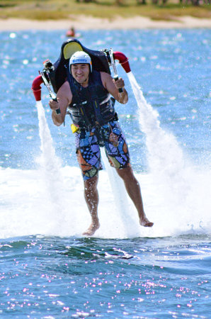 GOLD COAST - OCT 14 2014: Man ride a Jet pack.TÂ­he U.S. Army began researching rocket pack...
