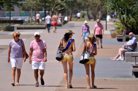 SURFERS PARADISE, AUS - NOV 02 2014:Meter maids walking down the Esplanade.They feed the meter to buy more time for motorists that overstay as a goodwill and promote Surfers Paradise for tourism.のeditorial素材
