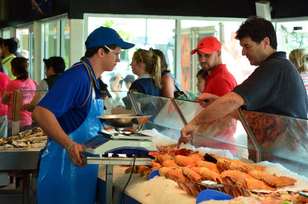 GOLD COAST - OCT 05 2014:Tourist and Australians buys sea food in Charis Seafood. It's one of the most famous and largest seafood outlets in the Gold Coast Queensland, Australia.のeditorial素材