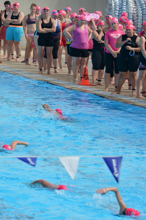 GOLD COAST - SEP 27 2014:Australian women participate in Triathlon Pink.It's an Australian sporting community event for women raising funds for charities who provide breast cancer support and researchのeditorial素材