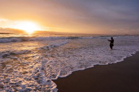 GOLD COAST, AUS - NOV 06 2014:Fisherman. Many fishermen in Gold Coast fear that the development plan of Wavebreak Island into integrated resort and cruise ship terminal will damage the fishing groundsのeditorial素材