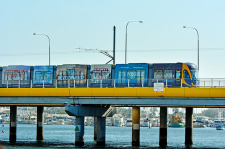 GOLD COAST, AUS - OCT 29 2014:Gold Coast Light Rail G cross over Sundale Bridge and Southport...