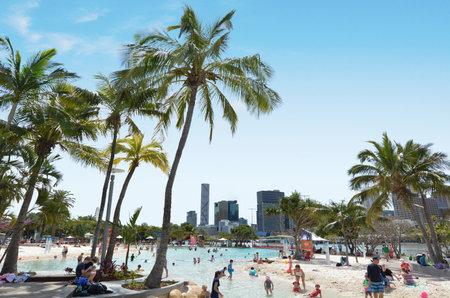 BRISBANE, AUS - SEP 25 2014:Visitors at Streets Beach in South Bank Parkland.It's Australiaâs only inner-city, man-made beach.It free to use and is patrolled by qualified lifeguards all year round.のeditorial素材