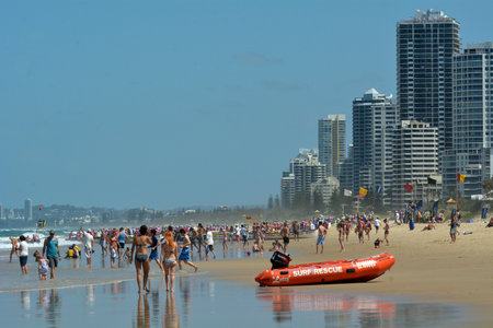 SURFERS PARADISE - NOV 08 2014:Visitors on main beach in Surfers Paradise.It one of Australia's iconic coastal tourist destinations, drawing about 10 million tourists every year from all over the world.のeditorial素材