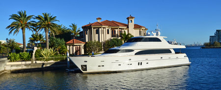 GOLD COAST - OCT 14 2014:Luxury home and super yacht in Sovereign Islands.It's one of the most expensive areas in Gold Coast Queensland and Australia with some homes in excess of 20 million dollars.のeditorial素材
