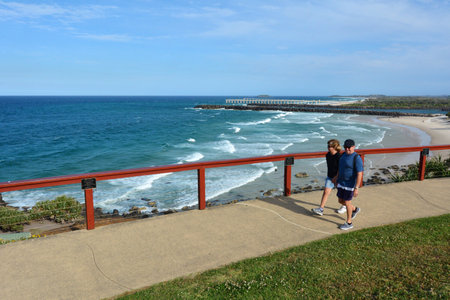 COOLANGATTA - OCT 07 2014:Couple walks in Snapper rocks.Coolangatta was one of the earliest settlements on the Gold Coast today it's a very popular tourist destination in Australia.のeditorial素材