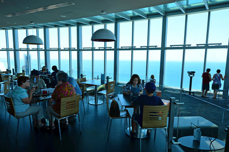 SURFERS PARADISE - NOV 14 2014:Visitors in Skypoint observation deck.It located 230 metres 750 ft off the ground at the top of the Q1 on the Gold Coast, Australia.のeditorial素材