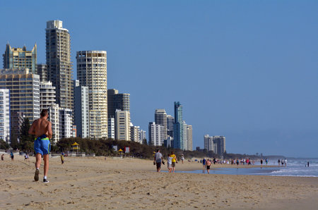 SURFERS PARADISE - NOV 14 2014:Visitors on main beach in Surfers Paradise.It one of Australia's iconic coastal tourist destinations, drawing about 10 million tourists every year from all over the world.のeditorial素材