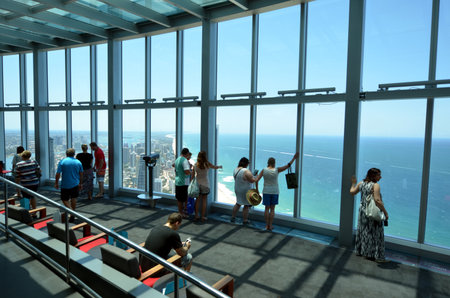 SURFERS PARADISE - NOV 14 2014:Visitors in Skypoint observation deck.It located 230 metres 750 ft off the ground at the top of the Q1 on the Gold Coast, Australia.のeditorial素材