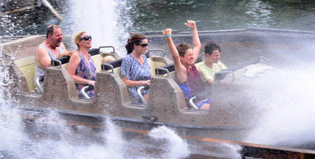 GOLD COAST, AUS -  NOV 12 2014:Visitors ride on Wild West Falls Adventure Ride in Movie World Gold Coast Queensland Australia.It's an 8-seater flume ride with the largest drop of its kind in Australia.のeditorial素材