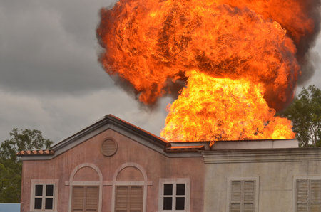 GOLD COAST, AUS -  NOV 06 2014: Fire blast over a building.Queensland's bushfire season traditionally runs from August to December each yearのeditorial素材