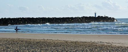 GOLD COAST - OCT 13 2014:Surfers at Seaway.It's the main navigation entrance from the Pacific Ocean into Gold Coast Broadwater. It's one of Australias most significant coastal engineering projects.のeditorial素材