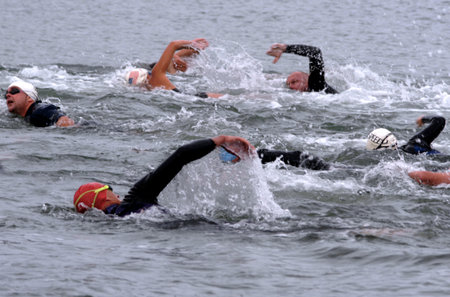 KERIKERI - NOV 10: Triathlon swimmers during the New Zealand Ironman Triathlon on November 10 2003 in Kerikeri, NZ. It's a races that include cycling, running and swimming.のeditorial素材