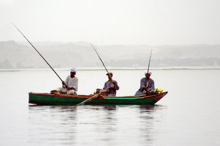 Nubian Egyptian villagers men are fishing in the Nile river, Egypt.のeditorial素材