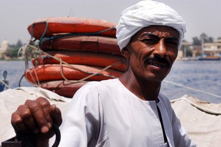 An Egyptian sailor in a night cruise on Egyptian felucca. near Luxor, Egypt.のeditorial素材
