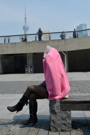 SHANGHAI, CN - MAR 17 2015:Visitors under Shanghai Oriental Pearl TV Tower in Shanghai, China. It's a famous landmark in Shanghai at 468 m 1,535 feet high.のeditorial素材
