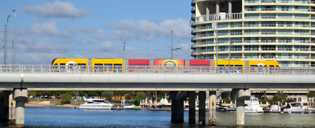 GOLD COAST, AUS - OCT 13 2014:Gold Coast Light Rail G cross over Sundale Bridge and Southport...