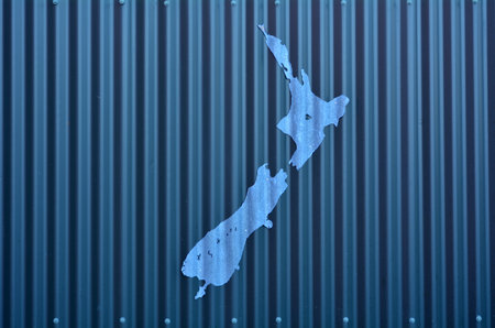 AUCKLAND, NZL - DEC 08 2014:Artwork of New Zealand shape on a wall. Because of New Zealand remoteness in the world, it was one of the last lands to be settled by humans.のeditorial素材