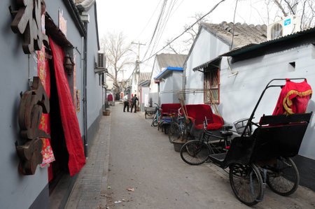 BEIJING - MARCH 12:Old Chines bicycle rickshaw in a Hutong old neighbourhood on March 12 2009 in...