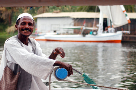 ASWAN - APRIL 30:Felucca sailor sails on the Nile river on April 30 2007 near Aswan, Egypt.The River Nile is about 6,670 km 4,160 miles in length and is the longest river in Africa and in the world.のeditorial素材