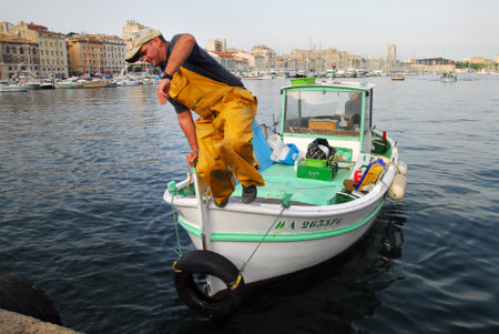 MARSEILLE - MAY 09:Fishing boat at Vieux-Port on May 09 2008 in Marseille,France.Marseille is France's largest city on the Mediterranean coast and largest commercial port.のeditorial素材