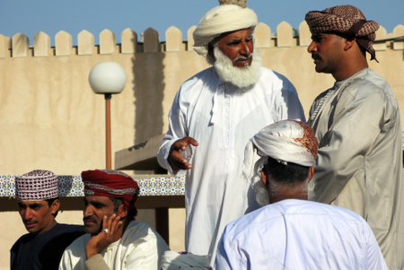 NIZWA, OMAN - DEC 28 2007:Omani men trade at the traditional Nizwa Cattle livestock market in Nizwa, Oman.It's a famous tourist sight seen in Nizwa, Oman.のeditorial素材