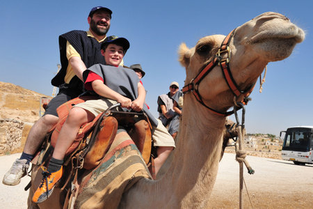 JERICHO - SEP 17:Tourists during camel ride on September 17 2008 in the Judean Desert, Israel.It's a rain shadow desert located between Jerusalem to Jericho 85 miles long and 25 miles wide.のeditorial素材