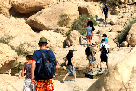 EIN GEDI, ISR - SEP 27 :Visitors hiking in Ein Gedi spring on Sep 27 2007. It's a very famous and popular  oasis on the shore of Israel's Dead Sea, the lowest place on Earth.のeditorial素材