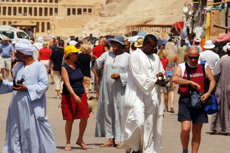LUXOR - MAY 02:Egyptians and tourist Interacting at the Great Temple of Hatshepsut on May 02 2007 in Luxor Egypt.The number of tourists visiting Egypt dropped by more than a third since the Egyptian revolution on Jan 25 2011.のeditorial素材