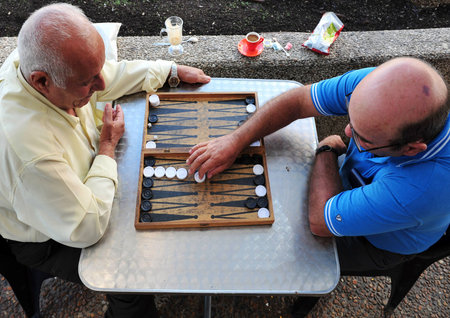 TEL AVIV - NOV 17: An old arab men playing backgammon on November 17 2008 in Tel Aviv, Israel.It's...