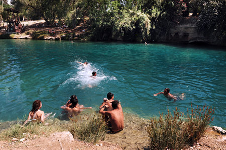 BEIT -SHEAN, ISRAEL - MAY 17:Visitors at Gan Hashlosha on May 17 2009 near Beit She'an, Israel.のeditorial素材