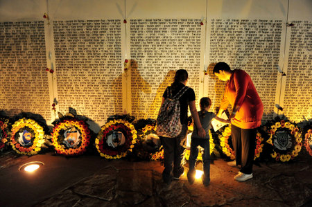 LATRUN - SEPTEMBER 23:Family at the memorial service on Wednesday September 23 2009, in The Latrun museum- Yad Lashiryon (Armoured Corps) Museum.のeditorial素材