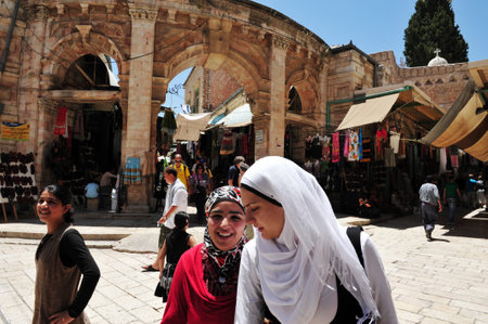 JERUSALEM - JULY 28: Muslim Arab women at Jerusalem old city market on July 28 2009.Jerusalem is a holy city to the three major Abrahamic religionsのeditorial素材